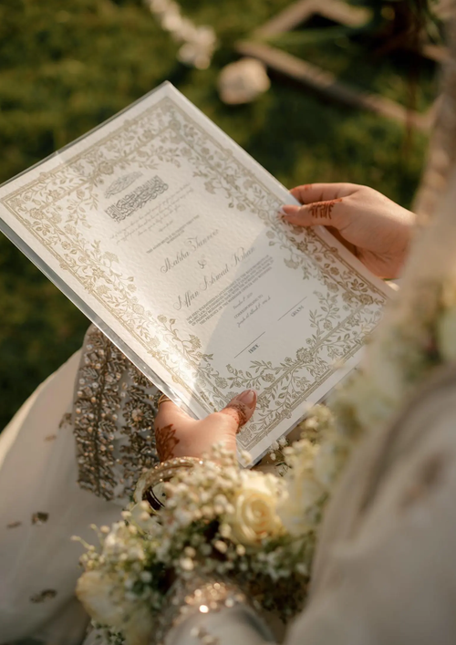 Certificat de mariage Meriam de Création Oriental, document officiel avec calligraphie arabe et motifs décoratifs.